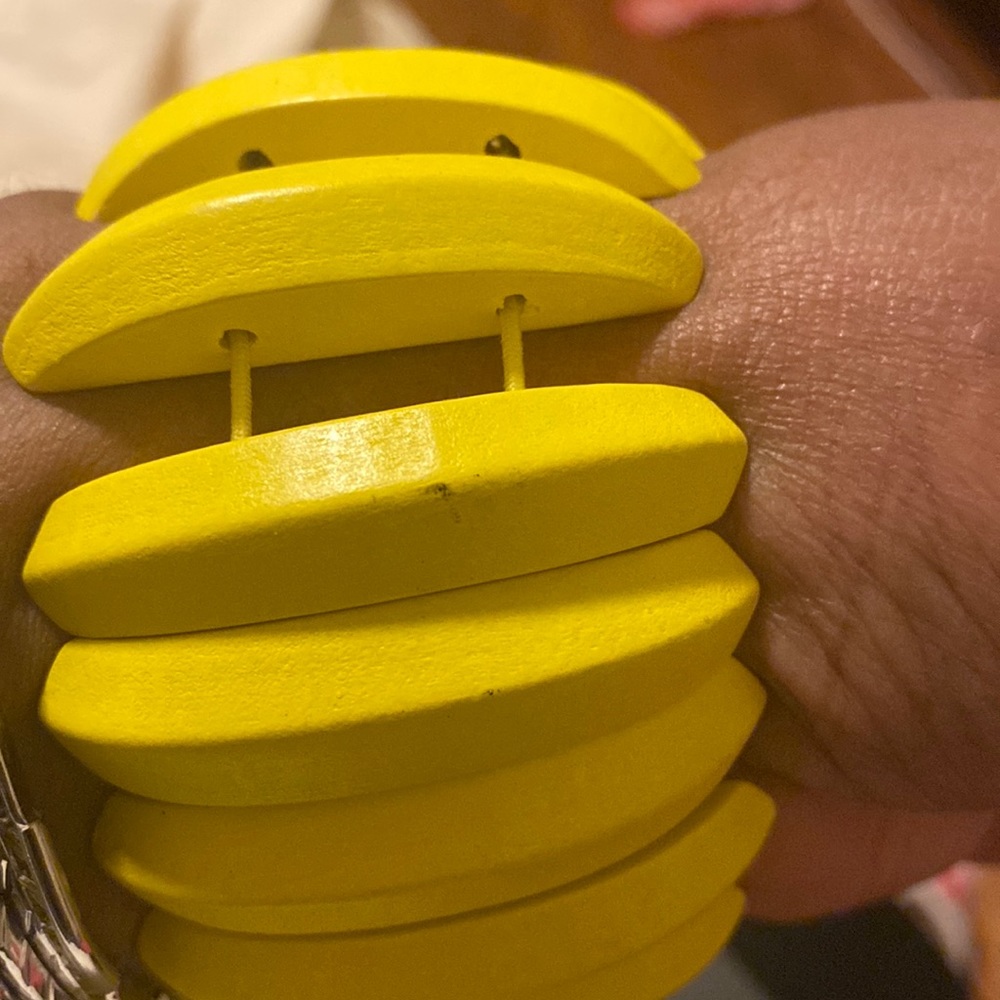 Yellow stretch wooden bracelet.